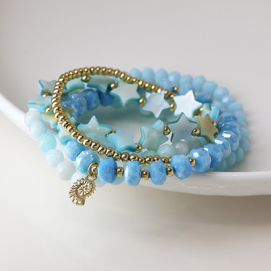 Five Stack Bracelets in Pale Blue with Gold Seashell