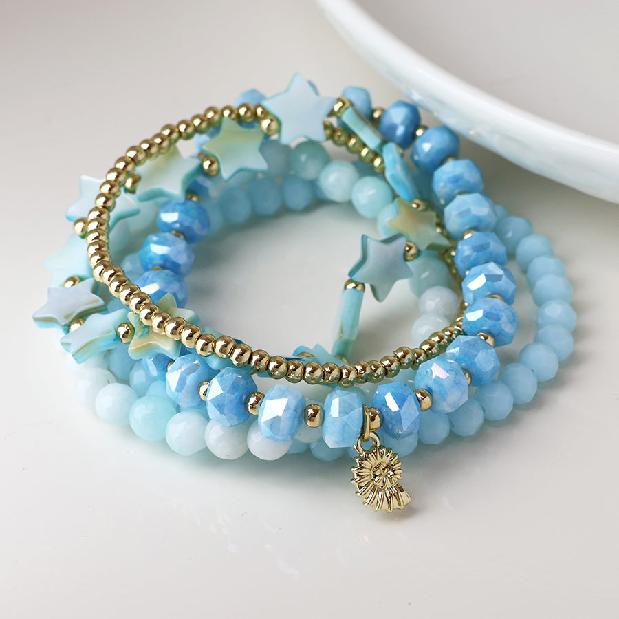 Five Stack Bracelets in Pale Blue with Gold Seashell